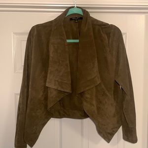 Microsuede draped from jacket. Brownish olive green
